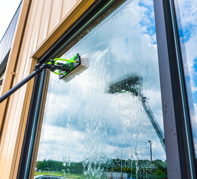Professional pure water fed window cleaning on a building